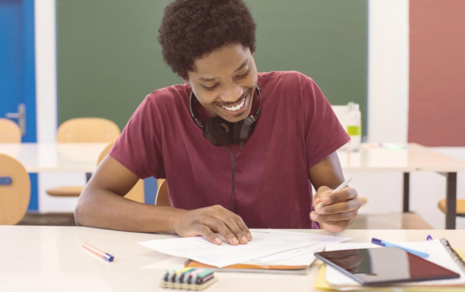 Professional reviewing financial research documents and market analysis reports